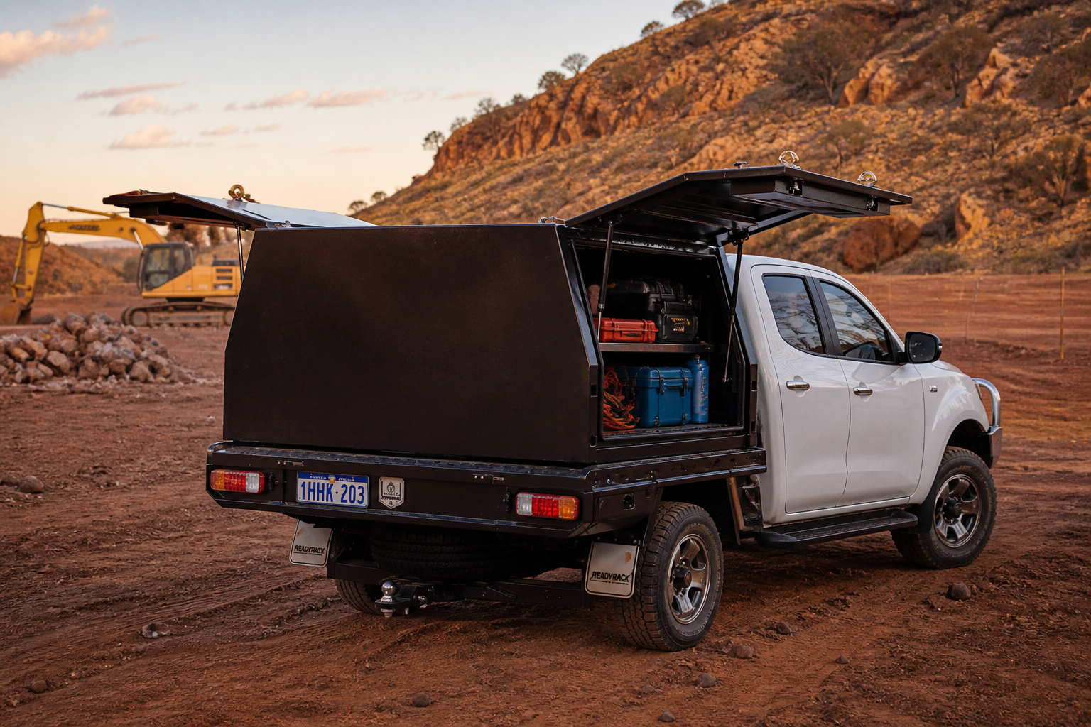 Heavy-duty aluminium ute canopy on ute tray in Australian outback worksite with organised tools, secure storage solution for tradies and 4WD use