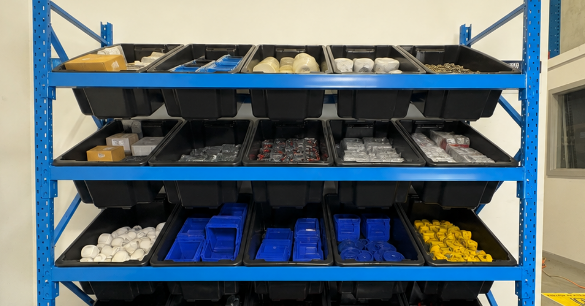 ReadyRack blue longspan shelving with black storage tubs filled with tools, hardware and workshop supplies.