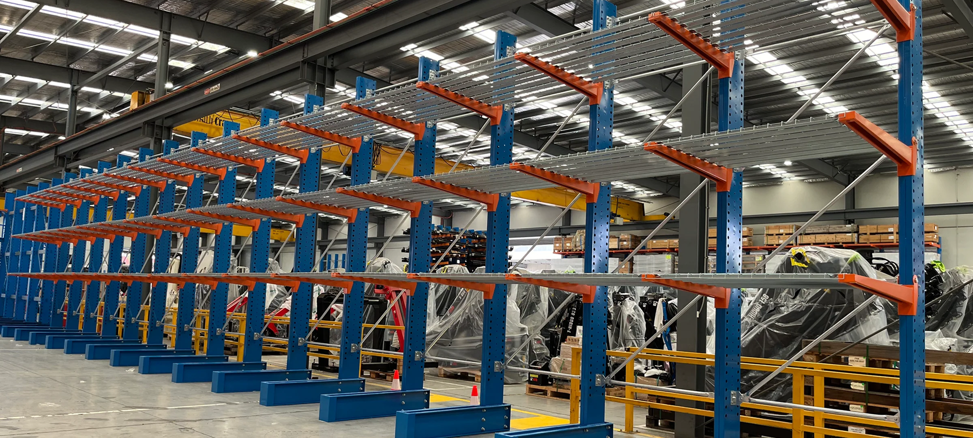 Long rows of blue storage racks in a warehouse setting