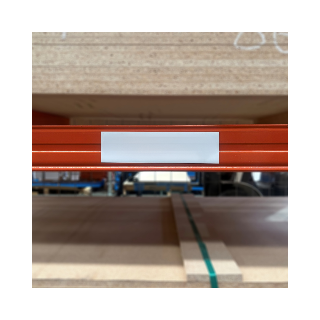 White gloss magnetic label fitted to an orange pallet racking beam for clear warehouse rack identification and labelling.